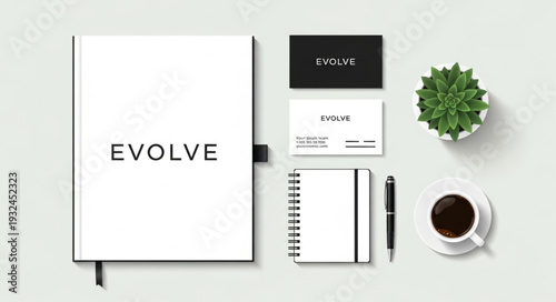 Minimalist office stationery set with notebook, pen, and business cards.