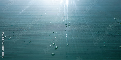 Abstract teal brushed metal texture.  Seamless, shiny, metallic background with vertical lines. Ideal for modern designs and industrial themes.