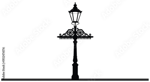 Elegant black lamp post with ornate details a striking silhouette