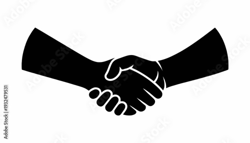 Business handshake between two businessmen symbolizing agreement and partnership isolated on white and black background