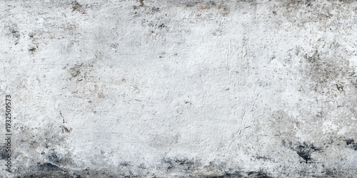 A rough vintage pattern of an old stone wall background features a gray grunge texture with a dirty concrete surface and weathered cement material design