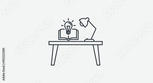 Desk with Open Book and Glowing Light Bulb Symbolizing Idea.