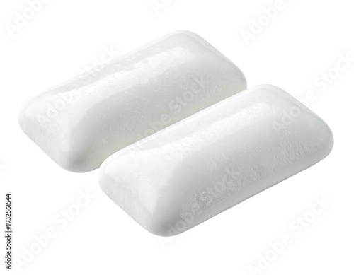 Two pristine, individually wrapped white chewing gum pieces on white