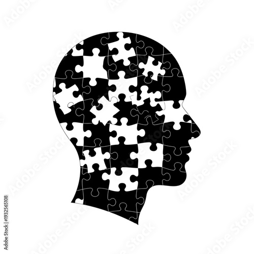 Black silhouette of a human head made of puzzle pieces on white background