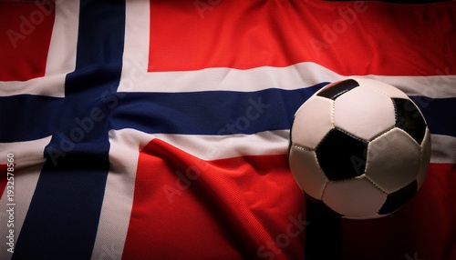 soccer ball placing on norway flag in dark room; free space for text