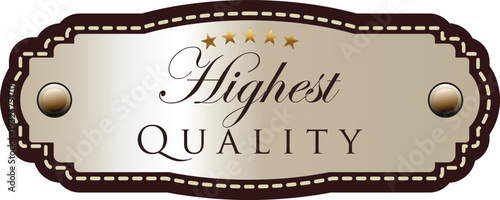 A beige and brown metal label with the words highest quality