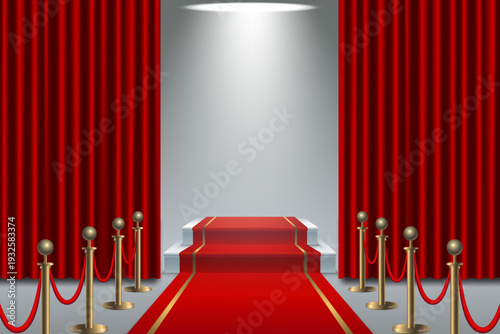 Red carpet leading to podium with spotlight