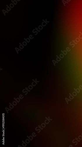Colorful real light leaks and lens flare effects moving and glowing on a dark background. Natural organic warm lighting transitions for overlaying on video, creating a vintage or retro feel