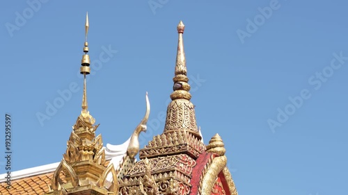 CHIANG MAI, THAILAND - FEBRUARY 3, 2026: Intricate golden architectural details and Buddha images at the famous Wat Phra That Doi Suthep temple complex. Close-up details of a sacred golden Buddha stat