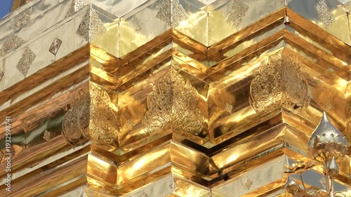 CHIANG MAI, THAILAND - FEBRUARY 3, 2026: Intricate golden architectural details and Buddha images at the famous Wat Phra That Doi Suthep temple complex. Close-up details of a sacred golden Buddha stat
