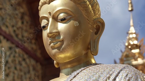 CHIANG MAI, THAILAND - FEBRUARY 3, 2026: Intricate golden architectural details and Buddha images at the famous Wat Phra That Doi Suthep temple complex. Close-up details of a sacred golden Buddha stat