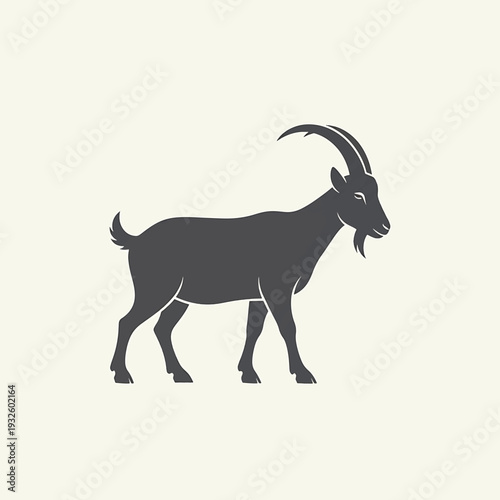 Silhouette of a majestic goat standing proudly.