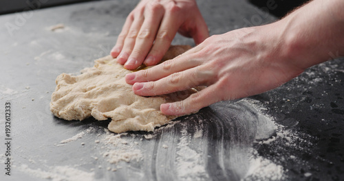Wallpaper Mural man add olive oil to dough on concrete countertop Torontodigital.ca