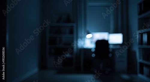 Dark Room with Computer Screen Glowing.
