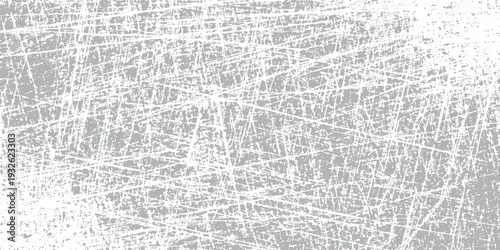Dense network of fine white scratches on a muted grey background creating a textured abstract pattern