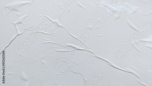 Blank abstract background of white crumpled paper. Creased poster texture with wavy surface. Wrinkled white paper background detail.