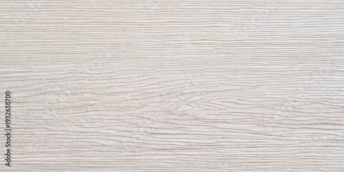 Light natural wood grain texture with horizontal lines, a pale blonde wood background with subtle imperfections.