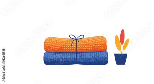 Stack of two cozy folded knit blankets in orange and blue colors next to a small potted plant on a plain white background.