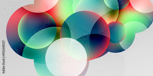 Abstract colorful bubbles overlap, creating vibrant gradients. Soft light illuminates shapes against dark background. Modern design.