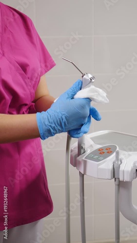 Dental tools being cleaned by assistant in modern dental clinic. Preparing dental office before patients. Vertical footage. Cleaning and disinfection in dentistry. Sterilization and disinfecting.4 k