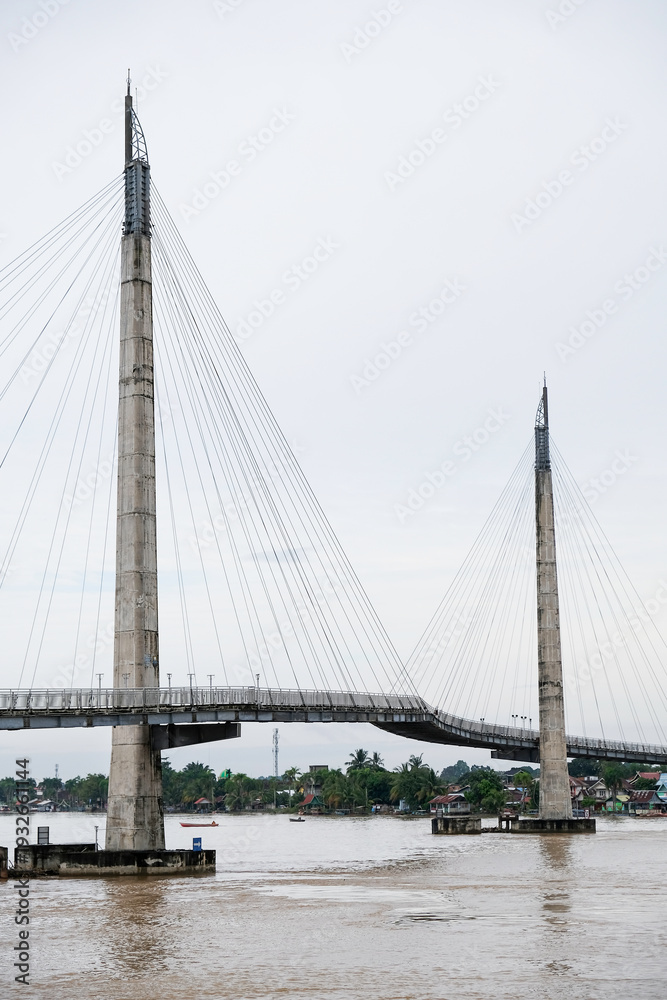 Fototapeta premium The iconic Gentala Arasy Bridge over the Batanghari River in Jambi