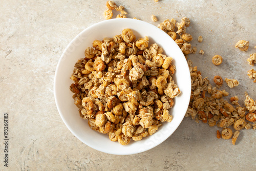 A top down view of a bowl of honey nut granola cereal.