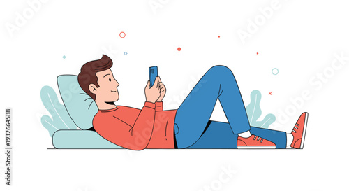 Young man relaxing comfortably while lying down on a cushion and using his smartphone for communication or social media browsing in simple style.