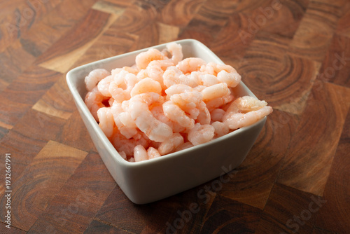 A view of a bowl of cooked bay shrimp.