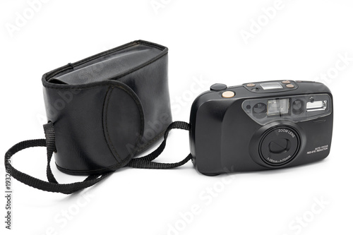 Vintage black 35mm compact analog film camera with original case and strap, featuring a 38-70mm zoom lens and built-in flash, isolated on a white background.