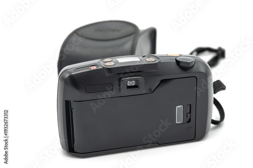 Rear view of a vintage black 35mm compact analog film camera featuring an LCD screen and viewfinder, with original case and strap on a white background.