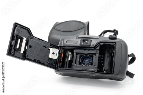 Rear view of a vintage 35mm film camera with an open back showing the internal film compartment and pressure plate, isolated on white background with case.