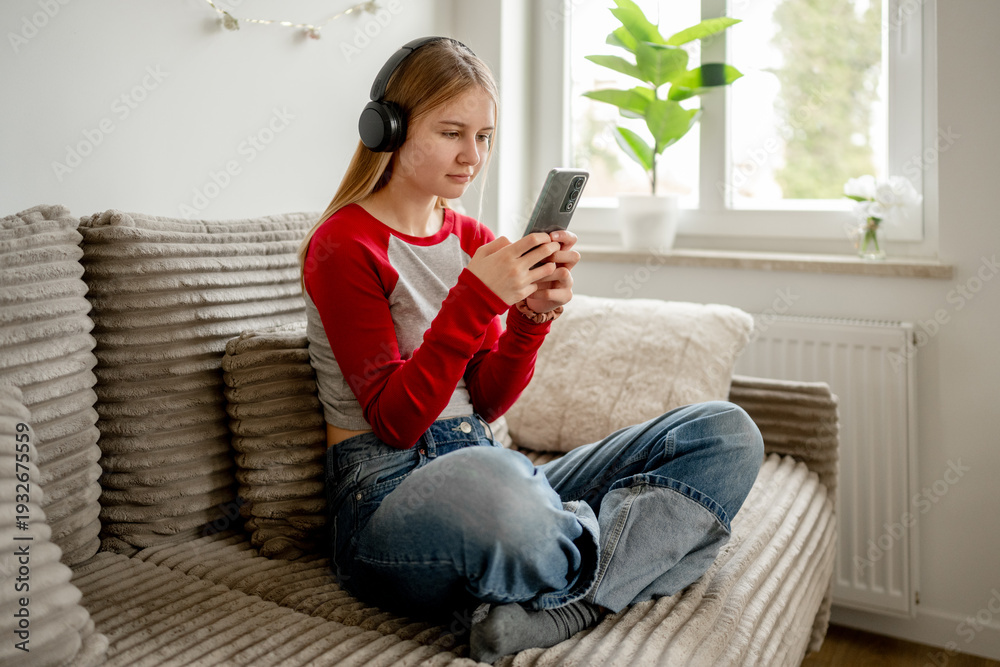 custom made wallpaper toronto digitalTeen Girl Sitting On The Couch With Headphones And Smartphone