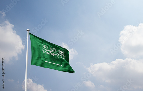Obraz na plátne Saudi Arabia national flag waving in sky.