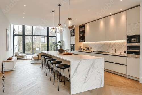 bright modern open-plan kitchen with long marble waterfall island, six black bar stools, globe pendant lights, floor-to-ceiling windows and cozy lounge area, calm inviting atmosphere