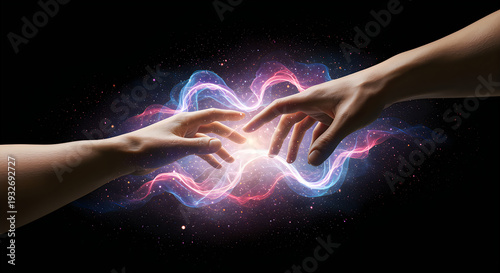 Hands reaching for each other with glowing light effect