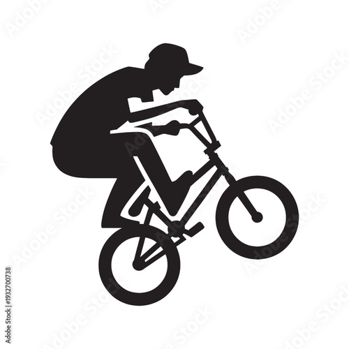 Silhouette of a BMX rider performing a trick on a bicycle, extreme sports, urban cycling, and action concept