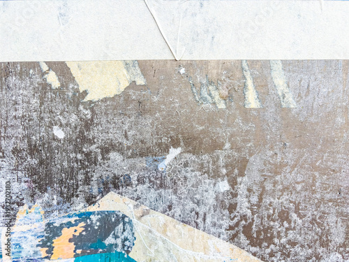 Vintage old posters stuck and torn on the wall in your grunge background