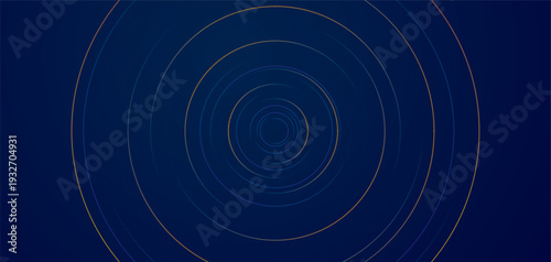 Concentric dotted circles in yellow blue and purple on dark blue background abstract