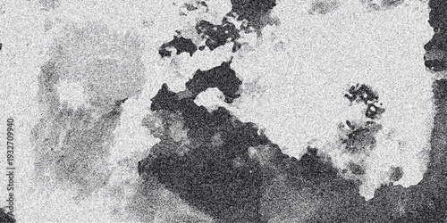 Abstract grayscale composition with amorphous dark shapes and granular noise, creating a textured and visually intriguing background for creative projects