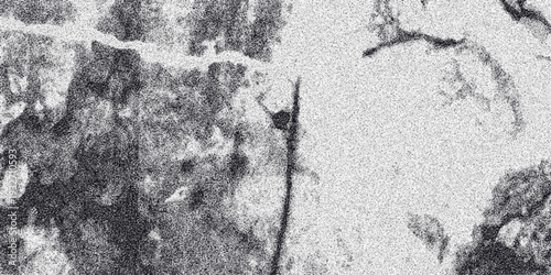 Close-up abstract grayscale texture with rough, irregular patches and granular noise, offering a detailed and artistic surface for backgrounds and design elements