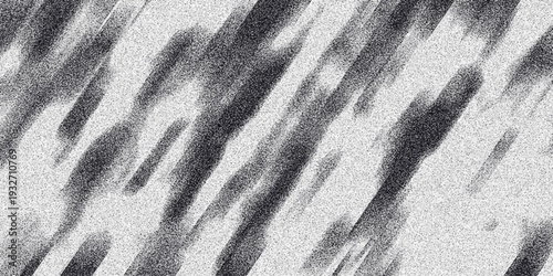 Diagonal abstract grayscale background with blurred streaks and granular noise, conveying a sense of speed and texture for dynamic visual designs