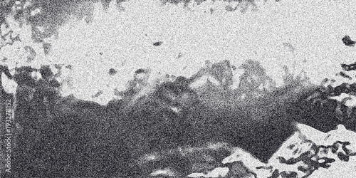 Monochrome abstract background with a cloudy or smoky texture and granular noise, offering a dramatic and atmospheric visual for artistic and design purposes