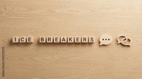 Wooden cubes spelling 'Ice Breakers' on desk, with conversation and speech bubble icons