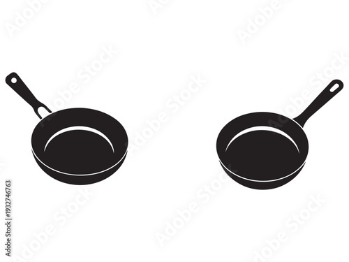 Two black frying pans with handles side by side on white background for cooking and kitchen use