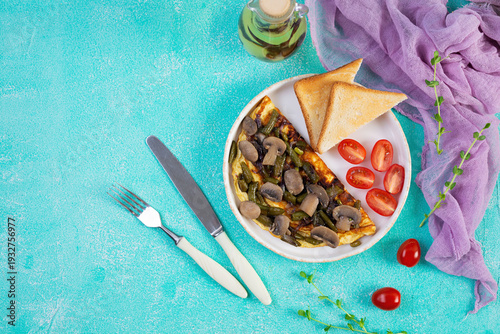 Omelette with mushrooms and green beans served with toast and cherry tomatoes