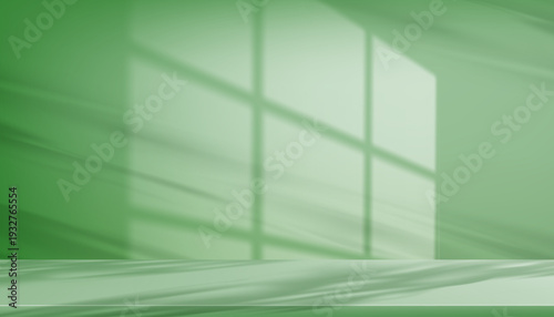 Shadow leave and blur gradient light on green studio background wall room and podium stage for product,Summer or Spring banner green pastel with abstract sunlight on floor texture