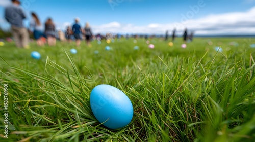 Groups of people search for colorful eggs scattered across a green field