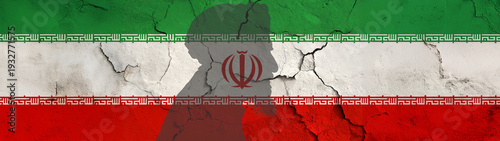 Wallpaper Mural Crack on painted Iran flag with  side view Silhouette of an old clergyman with turban and long beard Torontodigital.ca