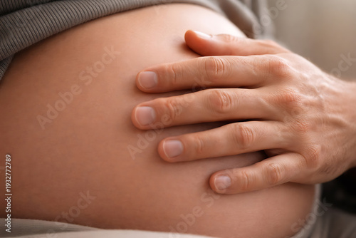 Wallpaper Mural Maternal Hands Cradling Pregnant Belly Maternity Wellness Prenatal Care and Patient Experience Photography for Obstetric Services Torontodigital.ca