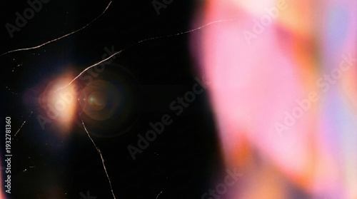 Orange pink lens flare cracked film dark abstract bokeh chromatic aberration glow